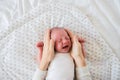 Unrecognizable mother caressing crying newborn baby son Royalty Free Stock Photo