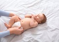 Mother changing baby& x27;s diaper on white, top view Royalty Free Stock Photo