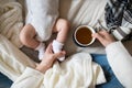 Unrecognizable mother with newborn baby son lying on bed Royalty Free Stock Photo