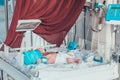 Newborn baby in an infant warmer in the hospital