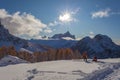 Unrecognizable pair of tourists take photos of beautiful winter scenery