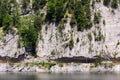 Unrecognizable people climbing on Laserer alpin via ferrata over Vorderer Gosausee lake near Gosau, Austria Royalty Free Stock Photo