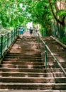 Unrecognizable people going up steep old McElhone stairs in Woolloomooloo Sydney NSW Australia