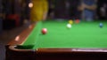 Unrecognizable people play billiards. snooker. the pocket is in focus. blurred background.