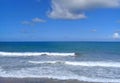 Unrecognizable people surfing and bodyboarding in the waves