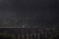 Unrecognizable people walking under the rain on stone bridge among tropical rainforest in Sri Lanka concept keep walking Royalty Free Stock Photo