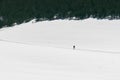 Unrecognizable person hiking in snowy landscape in winter