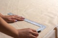 Unrecognizable Person is measuring fabric using rules Royalty Free Stock Photo