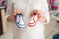 Unrecognizable pregnant woman shopping shoes for her baby Royalty Free Stock Photo