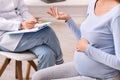 Unrecognizable Pregnant Woman Talking With Therapist In Office, Cropped Royalty Free Stock Photo