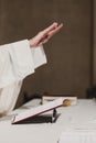 Unrecognizable Priest holding the goblet during a wedding ceremony nuptial mass. Religion concept Royalty Free Stock Photo