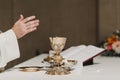 Unrecognizable Priest holding the goblet during a wedding ceremony nuptial mass. Religion concept