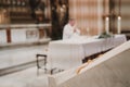 Unrecognizable Priest during a wedding ceremony nuptial mass. Religion concept. Selective focus