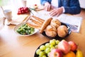 Unrecognizable senior couple eating breakfast at home. Royalty Free Stock Photo