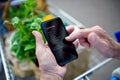 Unrecognizable senior couple man with smartphone doing shopping in supermarket. Royalty Free Stock Photo