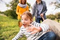 Senior couple with grandaughter gardening in the backyard garden Royalty Free Stock Photo