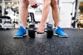 Unrecognizable senior man in gym working out with weights Royalty Free Stock Photo