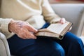 A senior woman reading Bible at home at Christmas time. Royalty Free Stock Photo