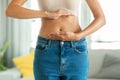 Unrecognizable Slim Woman Framing Flat Stomach And Belly Button Indoor Royalty Free Stock Photo