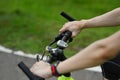 Unrecognizable sporty man riding a bicycle on country road. Travel, sport and active lifestyle concept. Royalty Free Stock Photo