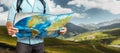 Young Traveler Man With Backpack Exploring Map In Mountains. Hiking Tourism Journey Concept