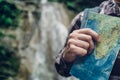 Unrecognizable Traveler Standing With Travel Map In Hand. Hiking Travel Tourism Concept