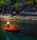Unrecognizable Vietnamese Woman Rowing Boats That Bring Tourists Traveling Inside Limestone Cave With Limestone Island