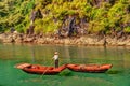 Unrecognizable Vietnamese Woman Rowing Boats That Bring Tourists Traveling Inside Limestone Cave With Limestone Island