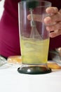 Unrecognizable woman beating egg whites on an electric blender until it peaks