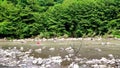 Unrecognizable woman crossing a mountain river ford