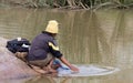 Unrecognizable woman doing the laundry in a river