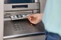 Unrecognizable woman getting dollar cash money from ATM outdoors, cropped image Royalty Free Stock Photo