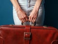 Unrecognizable Woman Holding Red Suitcase In Hands Royalty Free Stock Photo