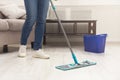 Unrecognizable woman with mop ready to clean floor Royalty Free Stock Photo