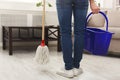 Unrecognizable woman with mop ready to clean floor Royalty Free Stock Photo