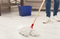 Unrecognizable woman with mop ready to clean floor Royalty Free Stock Photo