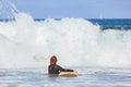 Unrecognizable woman with surfboard