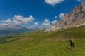 Unrecognizable woman watching wonderful summer dolomite panorama