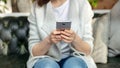 Unrecognizable woman writing text message using her cellular Royalty Free Stock Photo