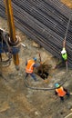 Unrecognizable workers with hydraulic hammer drilling machine at Royalty Free Stock Photo