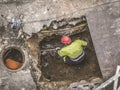Unrecognizable workers repairing the sewage system Royalty Free Stock Photo