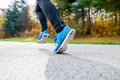 Young athlete running in park in colorful autumn nature. Royalty Free Stock Photo