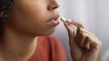 Unrecognizable Young Black Woman Taking White Pill At Home, Closeup Royalty Free Stock Photo