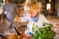 Young father with a toddler boy cooking. Royalty Free Stock Photo