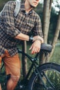 Unrecognizable Young Man Cyclist Standing With Bicycle Near Tree In Summer Park And Resting Recreation Travel Destination Concept