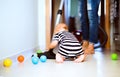 Young mother with a baby boy doing housework. Royalty Free Stock Photo