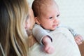 Unrecognizable young mother holding baby son in her arms Royalty Free Stock Photo