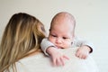 Unrecognizable young mother holding baby son in her arms Royalty Free Stock Photo