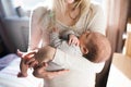 Unrecognizable young mother holding baby son in her arms Royalty Free Stock Photo
