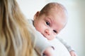 Unrecognizable young mother holding baby son in her arms Royalty Free Stock Photo